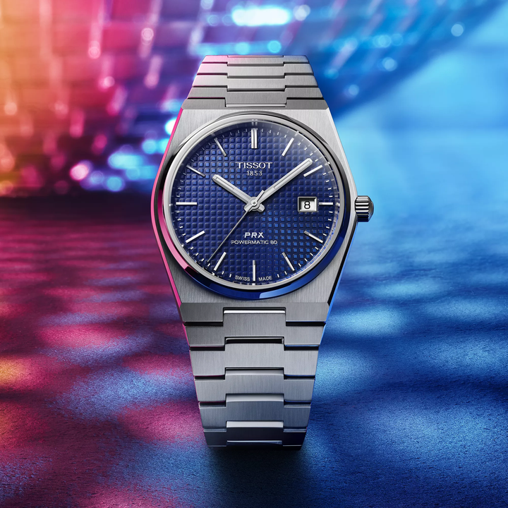 Tissot PRX 40mm watch on a colored background, reference T137.407.11.041.00