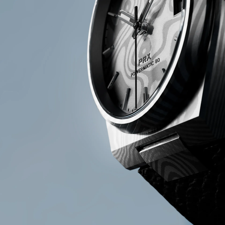Tissot PRX Damascus Steel 38mm watch on a colored background, reference T137.807.96.081.00