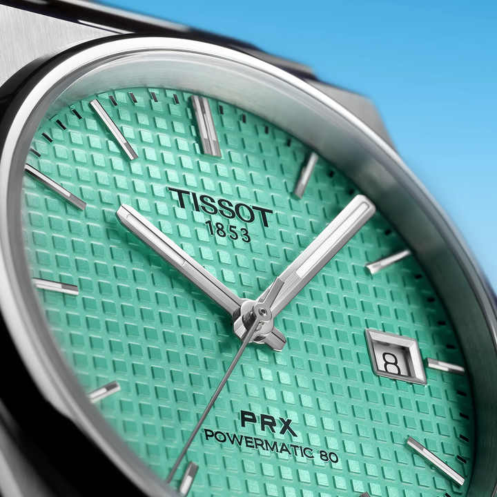 Tissot PRX 40mm watch on a colored background, reference T137.407.11.091.01