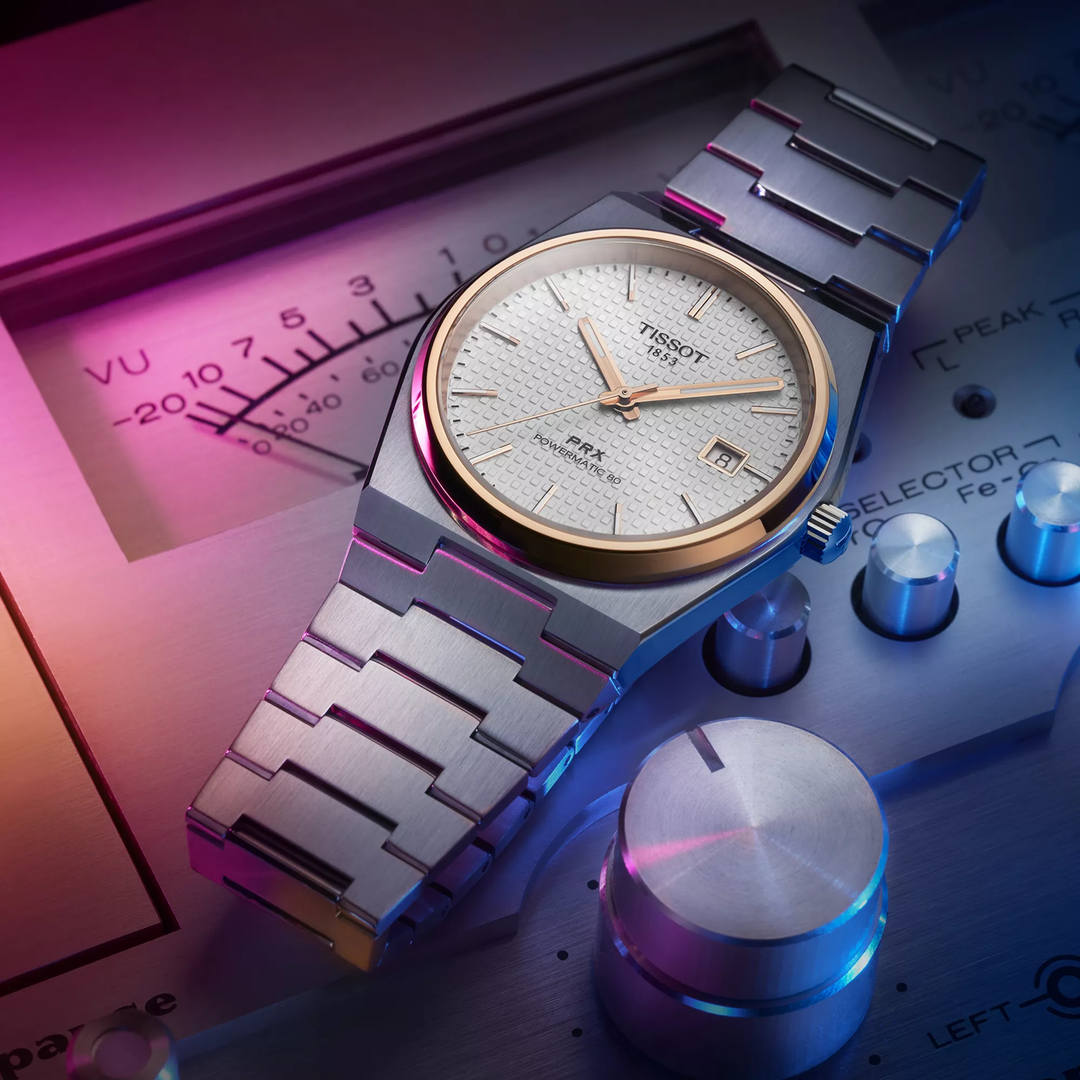 Tissot PRX 40mm watch on a colored background, reference T137.407.21.031.00