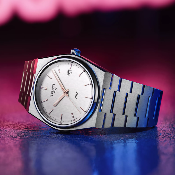 Tissot PRX 40mm watch on a colored background, reference T137.410.11.031.00