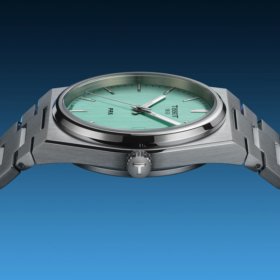 Tissot PRX 35mm watch on a colored background, reference T137.210.11.091.00