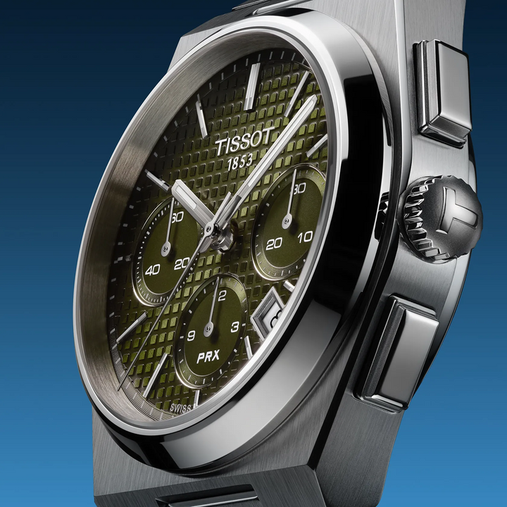 Tissot PRX 42mm watch on a colored background, reference T137.427.11.091.00