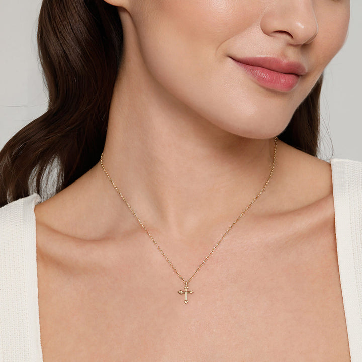 Gabriel & Co. 14K Yellow Gold Bujukan 12mm Cross Necklace — shown on a model; other jewellery sold separately — NK7670Y4JJJ