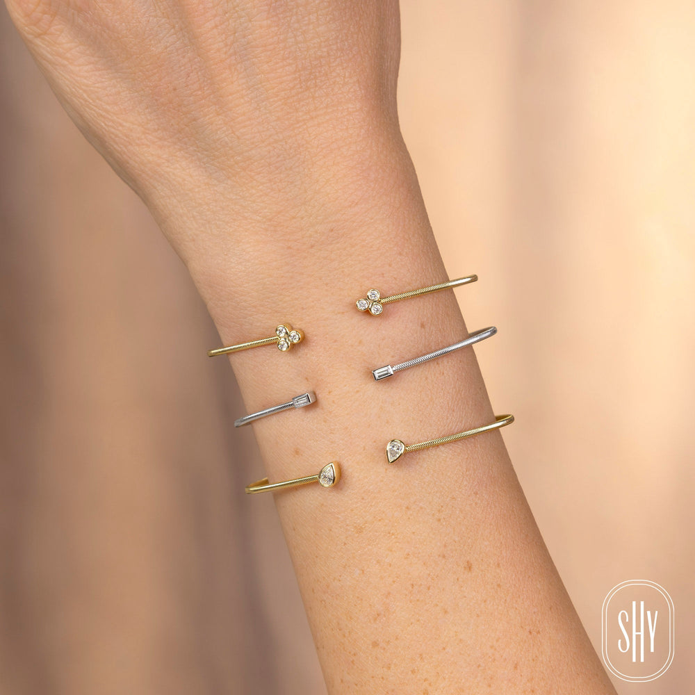 Shy Creation 0.22 ct Diamond Pear Bezel Bangle in 14K Yellow Gold — styled with other jewellery; additional pieces sold separately — B22001187ZS