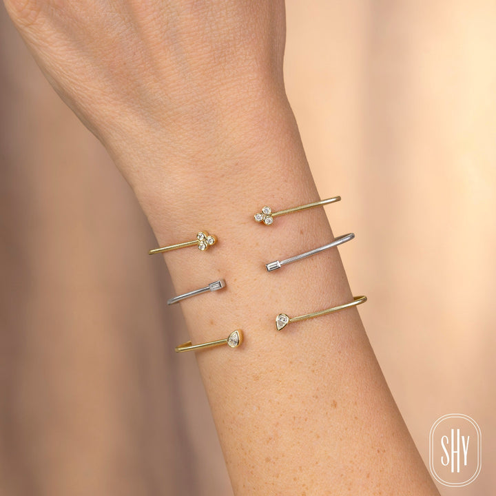 Shy Creation 0.22 ct Diamond Pear Bezel Bangle in 14K Yellow Gold — styled with other jewellery; additional pieces sold separately — B22001187ZS
