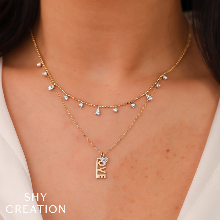 Shy Creation 0.64 ct Diamond Faceted Ball Chain Necklace in 14K Two-Tone Yellow Gold — styled with other jewellery; additional pieces sold separately — SC55027265