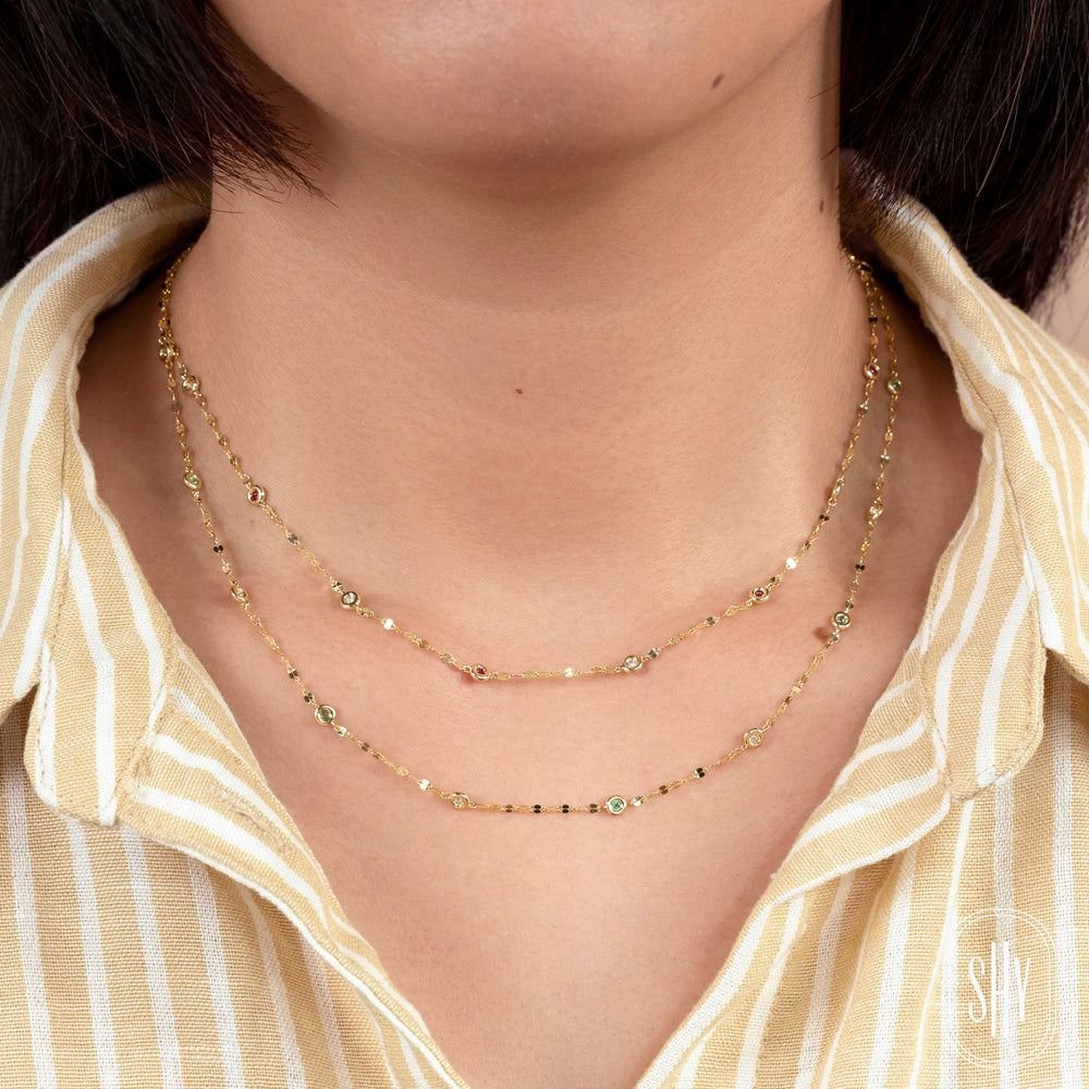 Shy Creation 0.09 ct Diamond & Ruby 18" Bezel-Set Diamond Station Sparkle Necklace in 14K Yellow Gold — styled with other jewellery; additional pieces sold separately — SC55029869