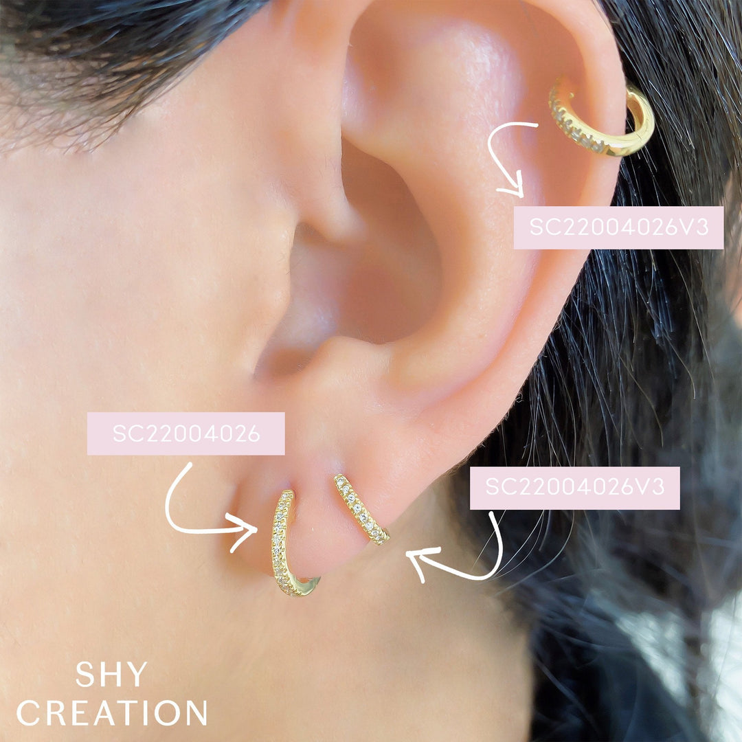 Shy Creation 0.07 ct Diamond Huggie Earrings in 14K Yellow Gold — styled with other jewellery; additional pieces sold separately — SC22004026