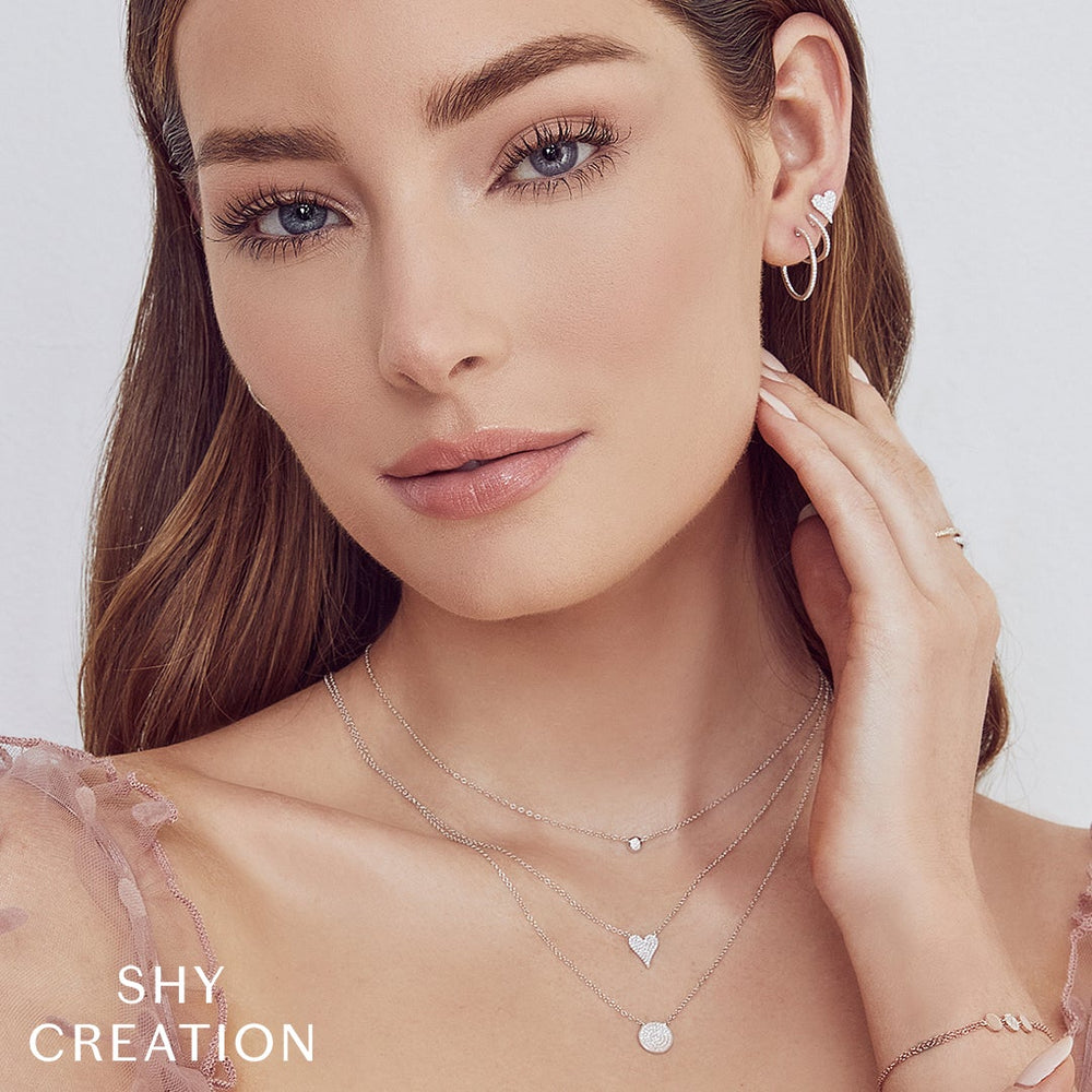 Shy Creation 0.11 ct Diamond Pavé Heart Necklace in 14K White Gold — styled with other jewellery; additional pieces sold separately — SC55006925