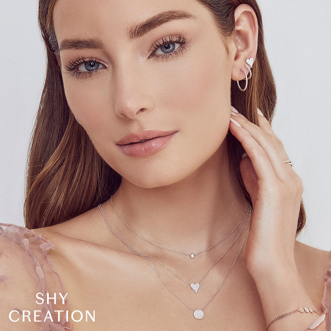 Shy Creation 0.11 ct Diamond Pavé Heart Necklace in 14K White Gold — styled with other jewellery; additional pieces sold separately — SC55006925