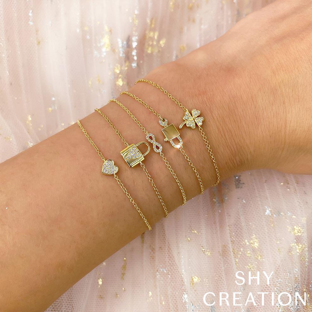 Shy Creation 0.04 ct Diamond Pavé Heart Bracelet in 14K Yellow Gold — styled with other jewellery; additional pieces sold separately — SC55002977