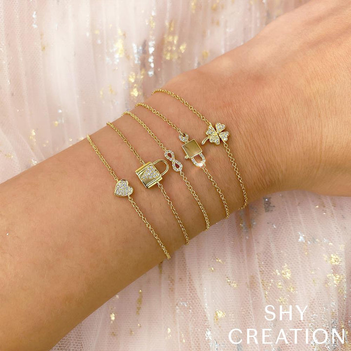 Shy Creation 0.04 ct Diamond Pavé Heart Bracelet in 14K Yellow Gold — styled with other jewellery; additional pieces sold separately — SC55002977