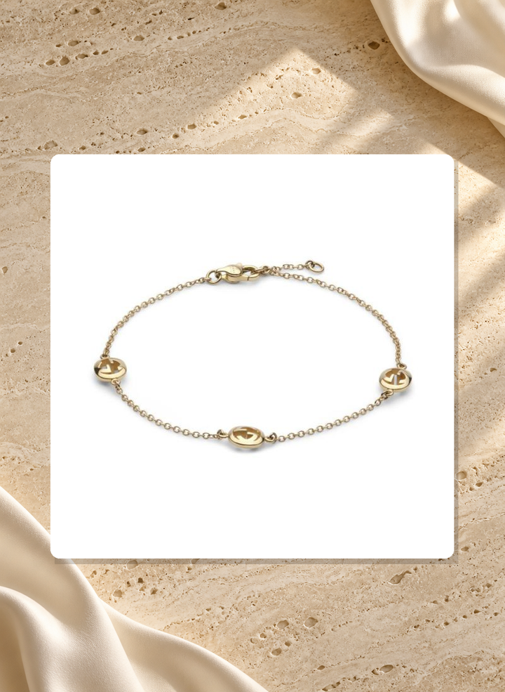 Gucci Interlocking G 18K Yellow Gold Three-Station Bracelet 17 cm YBA874214001017 lifestyle view