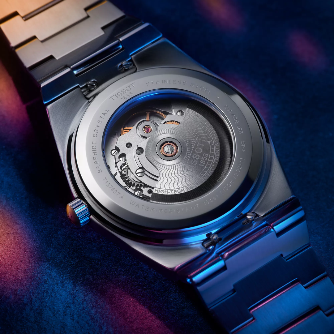 Tissot PRX 40mm watch on a colored background, reference T137.407.11.041.00