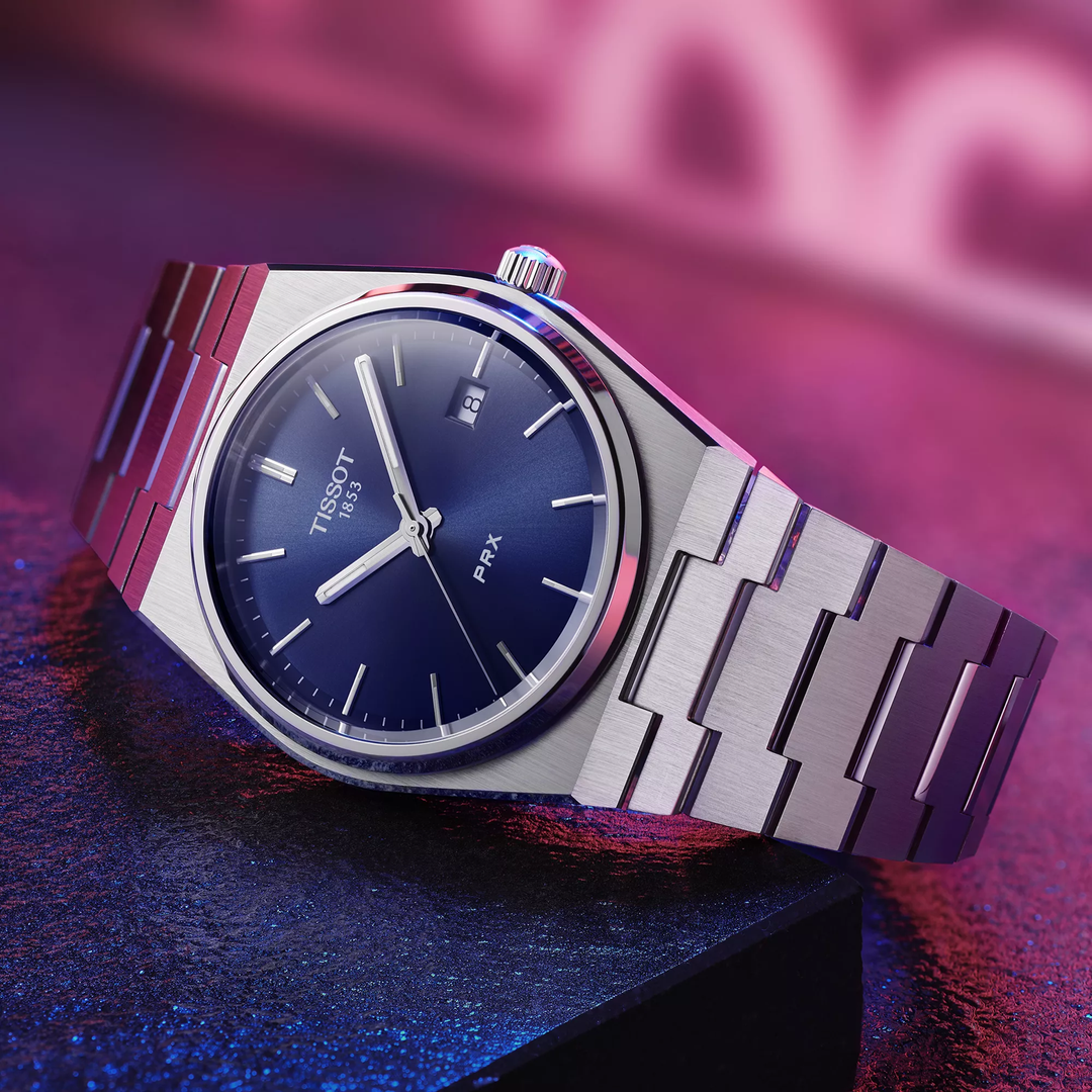 Tissot PRX 40mm watch on a colored background, reference T137.410.11.041.00
