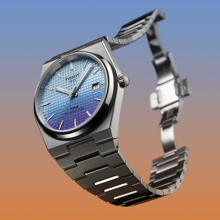 Tissot PRX 40mm watch on a colored background, reference T137.407.11.351.01
