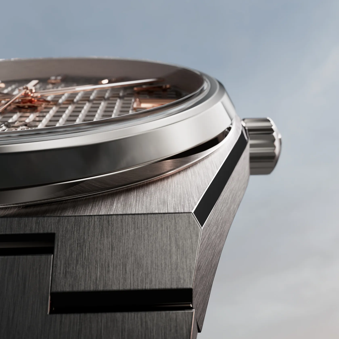 Tissot PRX Titanium 38mm watch on a colored background, reference T137.807.44.061.00