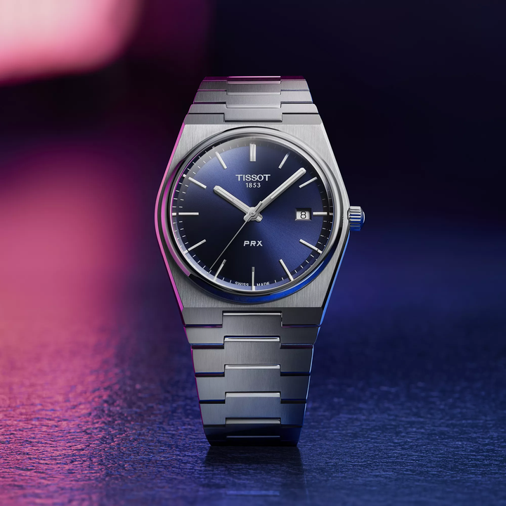 Tissot PRX 40mm watch on a colored background, reference T137.410.11.041.00