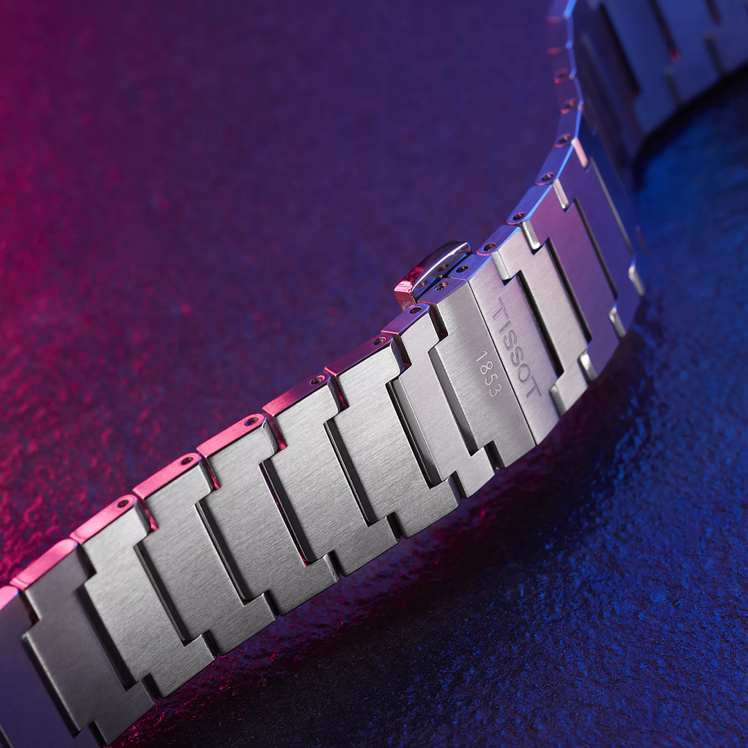 Tissot PRX 40mm watch on a colored background, reference T137.410.11.041.00