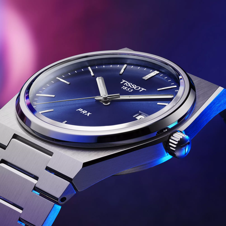 Tissot PRX 40mm watch on a colored background, reference T137.410.11.041.00