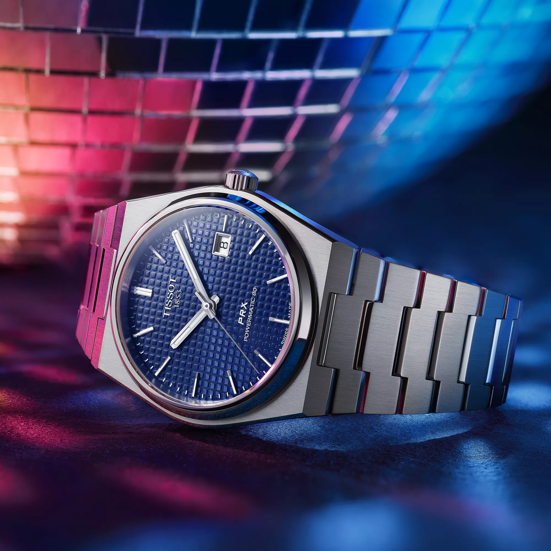 Tissot PRX 40mm watch on a colored background, reference T137.407.11.041.00