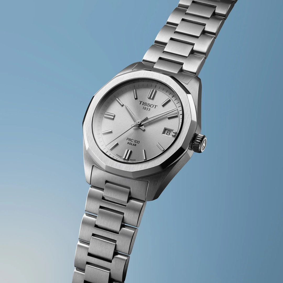 Tissot PRC 100 Solar 34mm watch on a colored background, reference T151.822.11.031.00