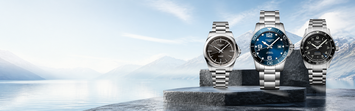 Longines watches displayed against a bright Swiss alpine landscape