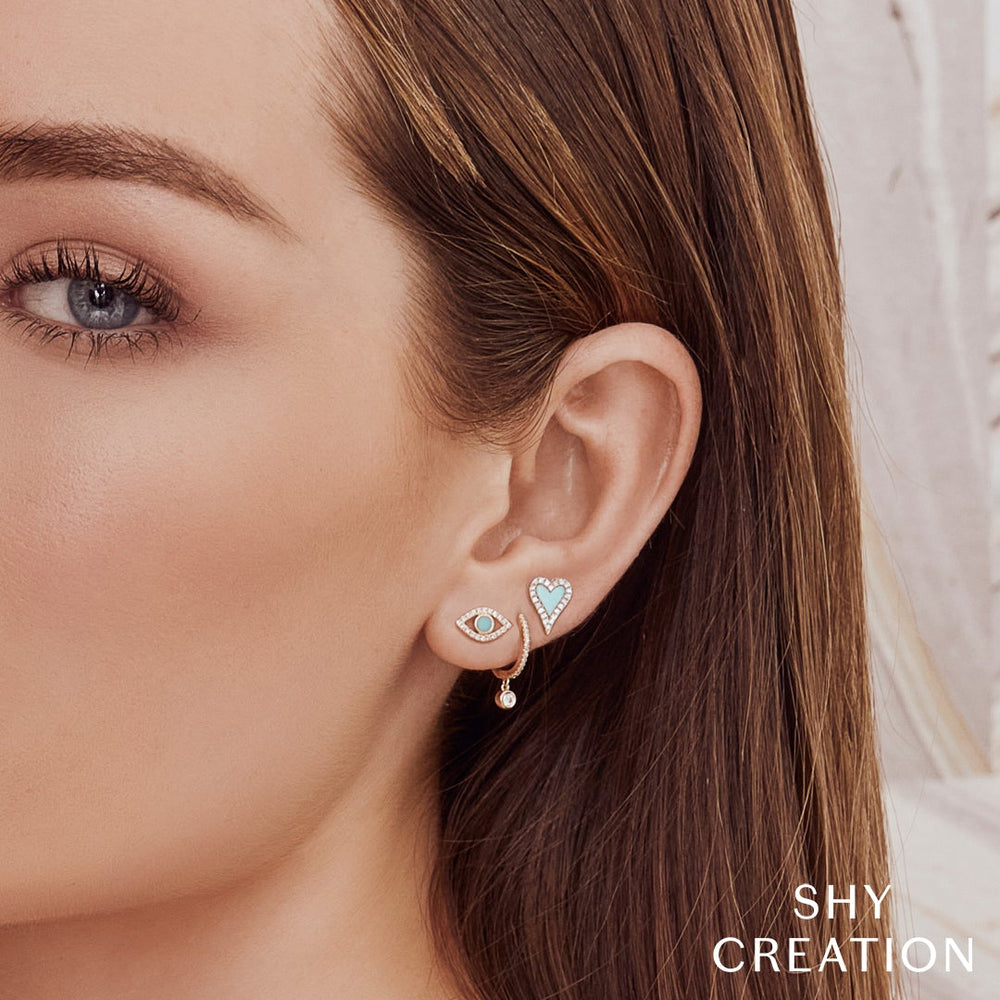 Shy Creation 0.14 ct Diamond Bezel Huggie Earrings in 14K Yellow Gold — SC22007645 — styled with other jewellery; additional pieces sold separately