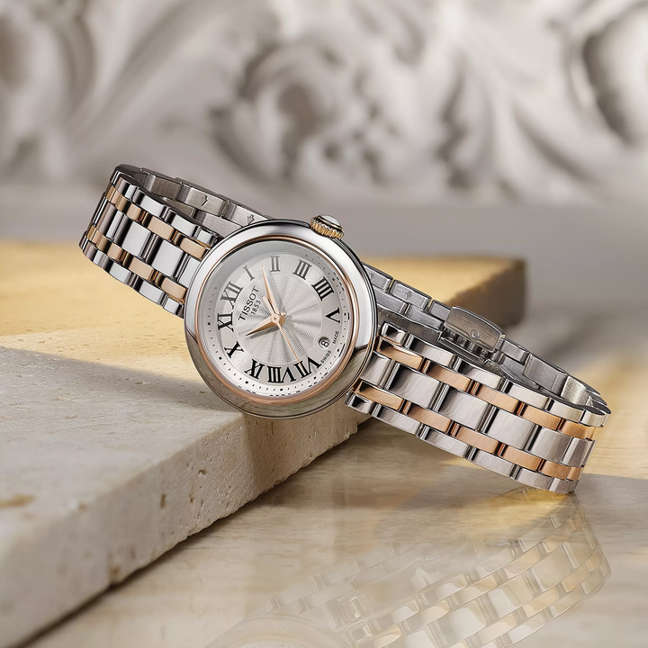 Tissot Bellissima 26mm watch on a colored background, reference T126.010.22.013.01