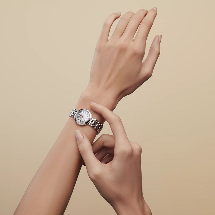 Tissot Bellissima 26mm watch on a colored background, reference T126.010.22.013.01