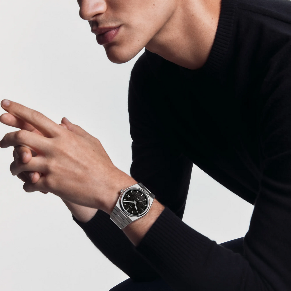 Simulation of the watch Tissot PRX 40mm on a wrist, reference T137.410.11.051.00