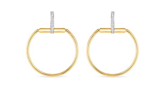 a mixed metal pair of hoop earrings with unique diamond details