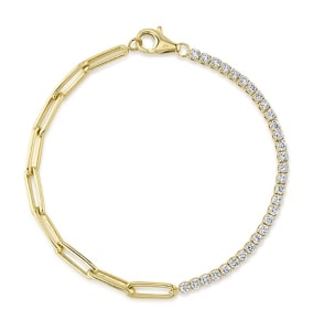 a paperclip gold chain combined with a tennis bracelet from Shy Creation.